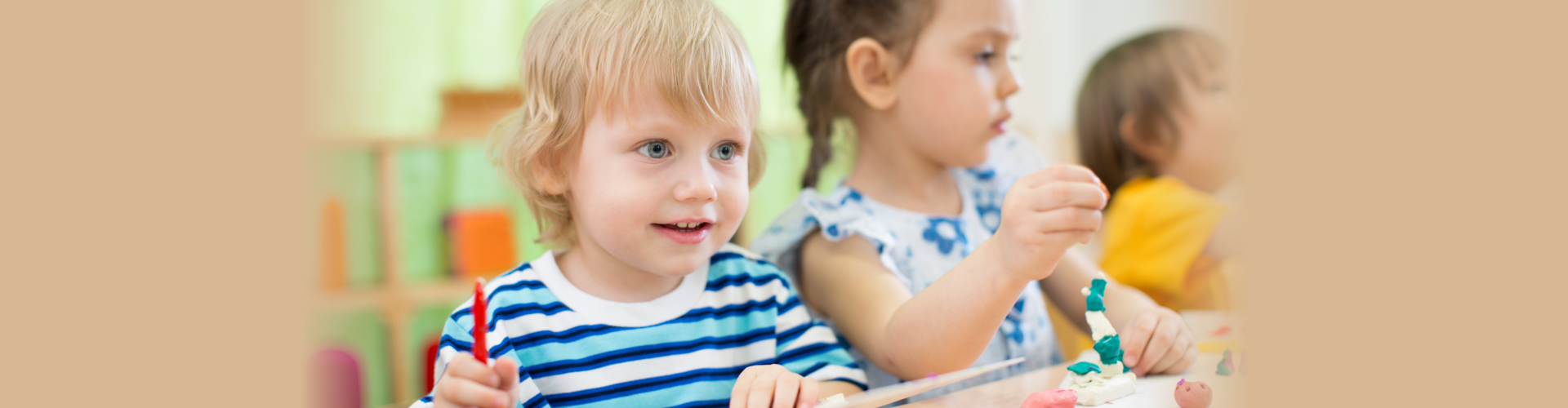 Kids making arts and crafts in day care centre together